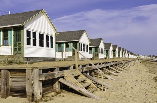 Conformity at the beach Long row of identical white beach cottages in Cape Cod, Massachusetts