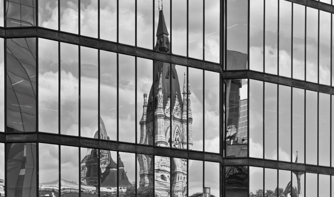 reflection of east block in city building windows