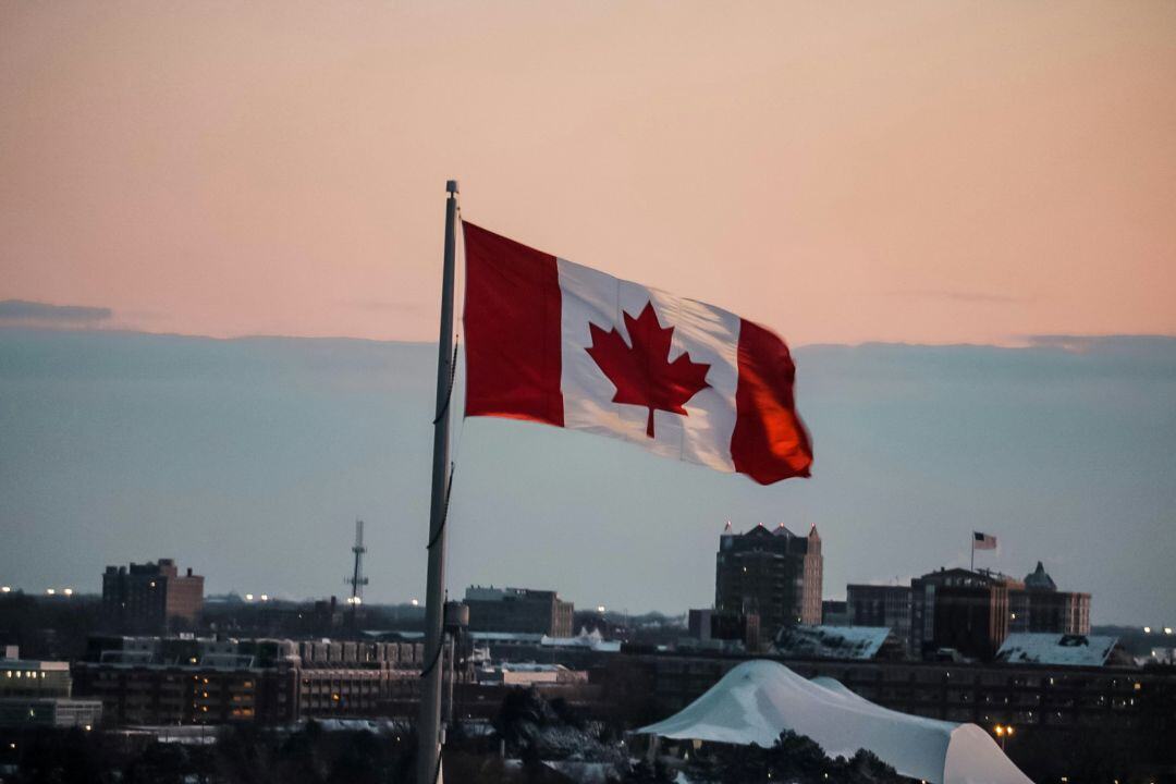 Canadian Flag waving at sunset